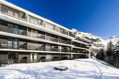 a large building with snow in front of it at Résidence Castor - maeva Home - Appartement 2 Pièces 6 Personnes - Confort MAE-3847 in Arâches-la-Frasse