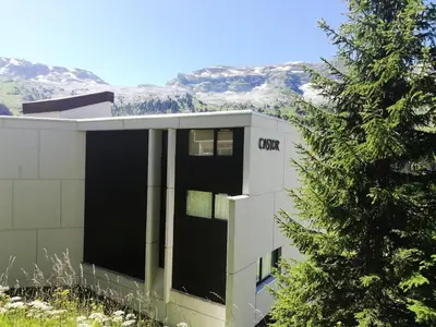 a building with a tree in front of it at Résidence Castor - maeva Home - Appartement 2 Pièces 6 Personnes - Confort MAE-3847 in Arâches-la-Frasse