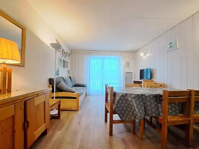 a living room with a table and a couch at Résidence Castor - maeva Home - Appartement 2 Pièces 6 Personnes - Confort MAE-3850 in Arâches-la-Frasse