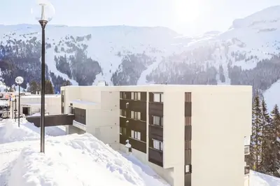 a building on top of a snow covered mountain at Résidence Sirius - maeva Home - Studio 4 Personnes - Confort MAE-3896 in Arâches-la-Frasse