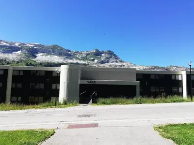 an office building with a mountain in the background at Résidence Sirius - maeva Home - Studio 4 Personnes - Confort MAE-3896 in Arâches-la-Frasse