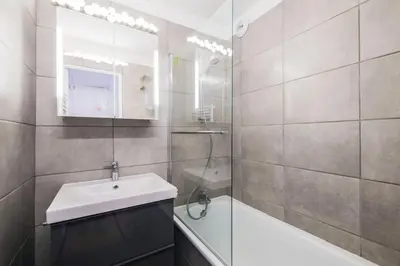 a bathroom with a sink and a shower and a mirror at Résidence Sirius - maeva Home - Studio 4 Personnes - Confort MAE-3896 in Arâches-la-Frasse