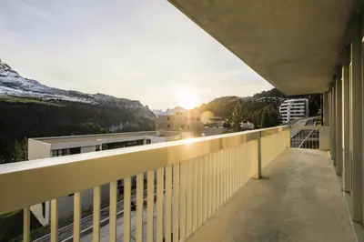 a balcony of a building with a view of the mountains at Résidence La Petite Ourse - maeva Home - Appartement 4 Pièces 6 Personnes - Sélection MAE-3904 in Arâches-la-Frasse