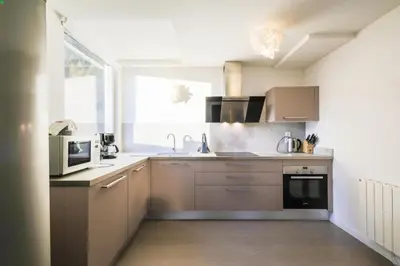 a kitchen with a sink and a microwave at Résidence La Petite Ourse - maeva Home - Appartement 4 Pièces 6 Personnes - Sélection MAE-3904 in Arâches-la-Frasse