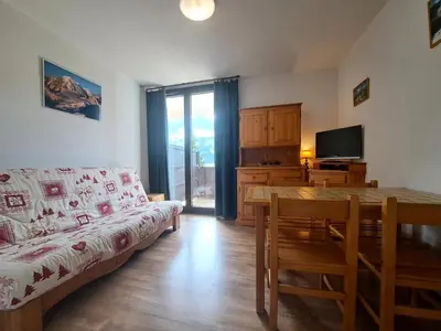 a living room with a couch and a dining room table at Résidence Doris - maeva Home - Studio 4 Personnes - Confort MAE-3910 in Arâches-la-Frasse