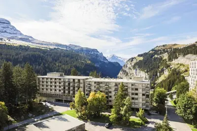 a view of a hotel with mountains in the background at Résidence Cassiopée - maeva Home - Appartement 2 Pièces 6 Personnes - Sélection MAE-3948 in Arâches-la-Frasse