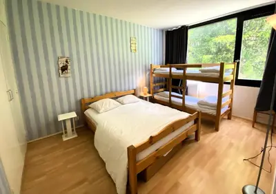 a bedroom with two bunk beds and a window at Résidence Eridan - maeva Home - Appartement 5 Pièces 10 Personnes - Confort MAE-3955 in Flaine