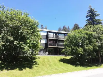 a large building with trees in front of it at Résidence Eridan - maeva Home - Appartement 5 Pièces 10 Personnes - Confort MAE-3955 in Flaine