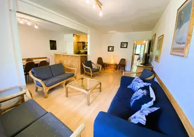 a living room with a blue couch and chairs at Résidence Eridan - maeva Home - Appartement 5 Pièces 10 Personnes - Confort MAE-3955 in Flaine