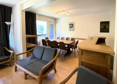 a living room with a dining room table and chairs at Résidence Eridan - maeva Home - Appartement 5 Pièces 10 Personnes - Confort MAE-3955 in Flaine