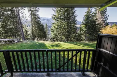a screened in porch with a view of the mountains at Résidence Pollux - maeva Home - Appartement 2 pièces 6 personnes - Budget MAE-4210 in Arâches-la-Frasse