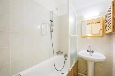 a bathroom with a shower and a sink and a tub at Résidence Pollux - maeva Home - Studio 4 personnes - Budget MAE-4213 in Arâches-la-Frasse