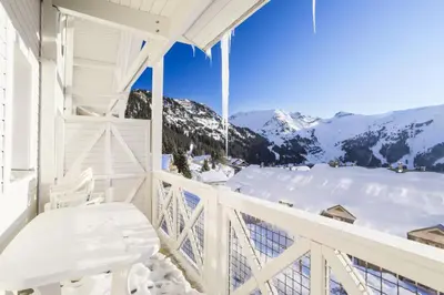 a white balcony with a view of snow covered mountains at Résidence Le Château de Crans - maeva Home - Appartement 3 Pièces 10 Personnes - Budget MAE-4252 in Flaine