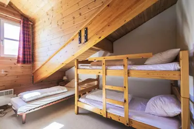 a room with two bunk beds in a cabin at Résidence Le Château de Crans - maeva Home - Appartement 3 Pièces 10 Personnes - Budget MAE-4252 in Flaine