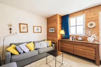a living room with a couch and a window at Résidence Le Château de Crans - maeva Home - Appartement 2 Pièces 6 Personnes - Prestige MAE-4253 in Flaine