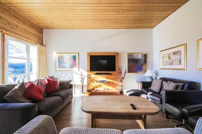 a living room with couches and a coffee table at Résidence Le Château de Crans - maeva Home - Appartement 5 pièces 10 personnes avec sauna privé - Prestige MAE-4441 in Flaine