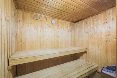 a wooden sauna with a wooden shelf in it at Résidence Le Château de Crans - maeva Home - Appartement 5 pièces 10 personnes avec sauna privé - Prestige MAE-4441 in Flaine