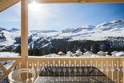 a balcony with a view of a snow covered mountain at Résidence Le Château de Crans - maeva Home - Appartement 5 pièces 10 personnes avec sauna privé - Prestige MAE-4441 in Flaine