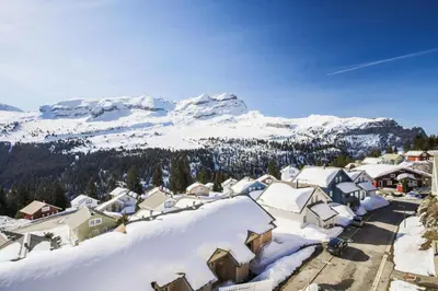 a town covered in snow with mountains in the background at Résidence Le Château de Crans - maeva Home - Appartement 5 pièces 10 personnes avec sauna privé - Prestige MAE-4441 in Flaine