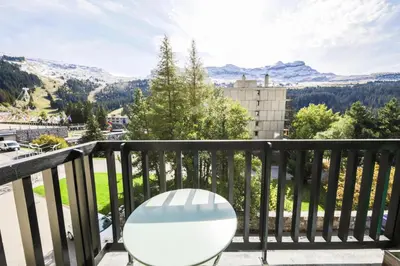 a white chair sitting on a balcony with a view at Résidence Véga - maeva Home - Studio 4 Personnes - Budget MAE-4467 in Arâches-la-Frasse