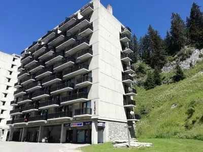 a building with balconies on the side of a hill at Résidence Véga - maeva Home - Studio 4 Personnes - Budget MAE-4467 in Arâches-la-Frasse