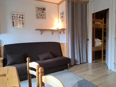 a living room with a couch and a table at Résidence Véga - maeva Home - Studio 4 Personnes - Budget MAE-4467 in Arâches-la-Frasse