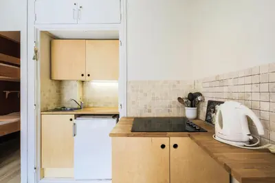 a kitchen with a sink and a white appliance at Résidence Véga - maeva Home - Studio 4 Personnes - Budget MAE-4467 in Arâches-la-Frasse