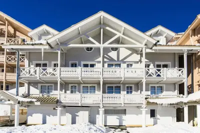 a white apartment building with a balcony at Résidence Le Château de Crans - maeva Home - Studio 4 Personnes - Confort MAE-4490 in Flaine