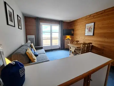 a living room with a couch and a table at Résidence Le Château de Crans - maeva Home - Studio 4 Personnes - Confort MAE-4490 in Flaine