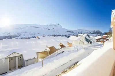 a town covered in snow with mountains in the background at Résidence Le Château de Crans - maeva Home - Studio 4 Personnes - Confort MAE-4490 in Flaine