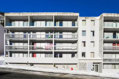 an apartment building with balconies in the snow at Résidence La Petite Ourse - maeva Home - Studio 3 Personnes - Sélection MAE-4901 in Arâches-la-Frasse