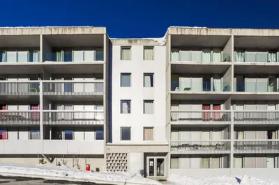 an apartment building with snow in front of it at Résidence La Petite Ourse - maeva Home - Studio 3 Personnes - Sélection MAE-4901 in Arâches-la-Frasse