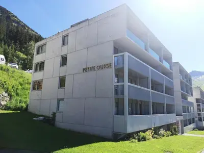 a concrete building with a white universe sign on it at Résidence La Petite Ourse - maeva Home - Studio 3 Personnes - Sélection MAE-4901 in Arâches-la-Frasse