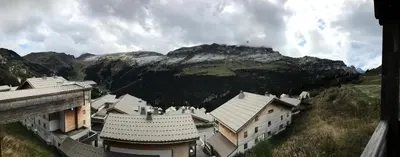a group of buildings in front of a mountain at Résidence Refuge du Golf - maeva Home - Appartement 4 Pièces 8 Personnes - Prestige MAE-5505 in Arâches-la-Frasse