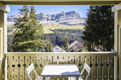 a balcony with a table and a view of mountains at Résidence Arbaron - maeva Home - Studio 4 personnes - Confort MAE-8638 in Flaine