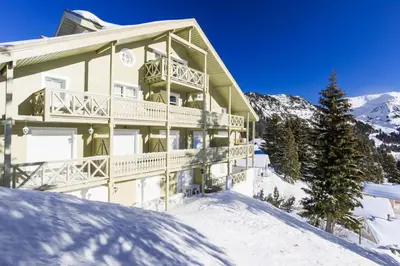 a large building in the snow with snow at Résidence Arbaron - maeva Home - Studio 4 personnes - Confort MAE-8638 in Flaine