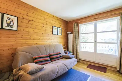 a living room with a couch and a window at Résidence Arbaron - maeva Home - Studio 4 personnes - Confort MAE-8638 in Flaine