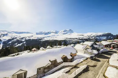 a village covered in snow with mountains in the background at Résidence Le Château de Crans - maeva Home - Studio 4 Personnes - Confort MAE-9176 in Flaine