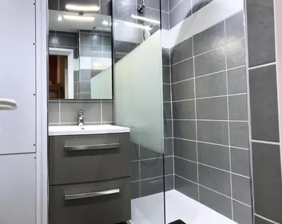 a bathroom with a shower with a sink and a mirror at Résidence Le Château de Crans - maeva Home - Studio 4 Personnes - Confort MAE-9176 in Flaine