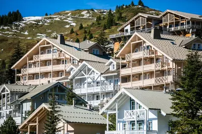 a group of houses on the side of a mountain at Résidence Le Château de Crans - maeva Home - Studio 4 Personnes - Confort MAE-9176 in Flaine