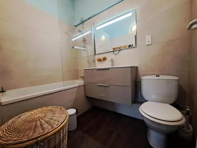 a bathroom with a toilet and a sink and a mirror at Les Chalets de Flaine Hameau - maeva Home - Chalet 5 Pièces 8 Personnes - Sélection MAE-2135 in Flaine