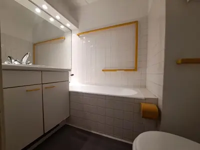 a bathroom with a tub and a toilet and a sink at Résidence Cassiopée - maeva Home - Appartement 4 pièces 6 personnes - Confort MAE-3654 in Arâches-la-Frasse