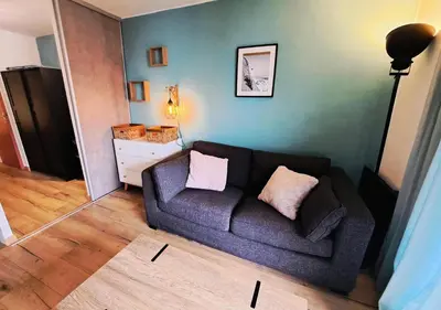 a living room with a couch and a table at Résidence Sirius - maeva Home - Studio 4 personnes - Confort MAE-3534 in Arâches-la-Frasse
