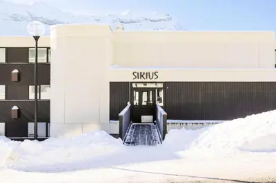 a building with snow in front of it at Résidence Sirius - maeva Home - Studio 4 personnes - Confort MAE-3534 in Arâches-la-Frasse