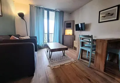 a living room with a couch and a table at Résidence Sirius - maeva Home - Studio 4 personnes - Confort MAE-3534 in Arâches-la-Frasse