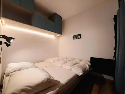 a bed in a room with a light on it at Résidence Sirius - maeva Home - Studio 4 personnes - Confort MAE-3534 in Arâches-la-Frasse