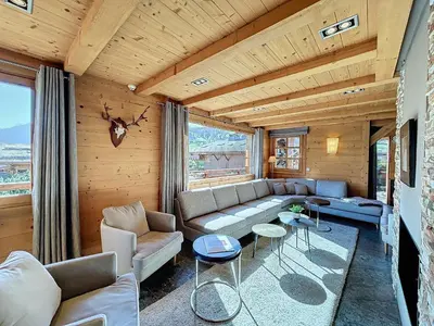 a living room with a couch and a table at Superbe chalet au calme avec jardin, garage et Wifi - FR-1-560-130 in Combloux