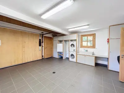 an empty garage with a washer and dryer at Superbe chalet au calme avec jardin, garage et Wifi - FR-1-560-130 in Combloux