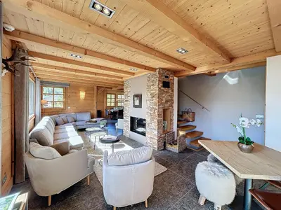 a living room with a couch and a table at Superbe chalet au calme avec jardin, garage et Wifi - FR-1-560-130 in Combloux