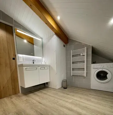 a laundry room with a sink and a washing machine at Al_titude1138 in Les Contamines-Montjoie